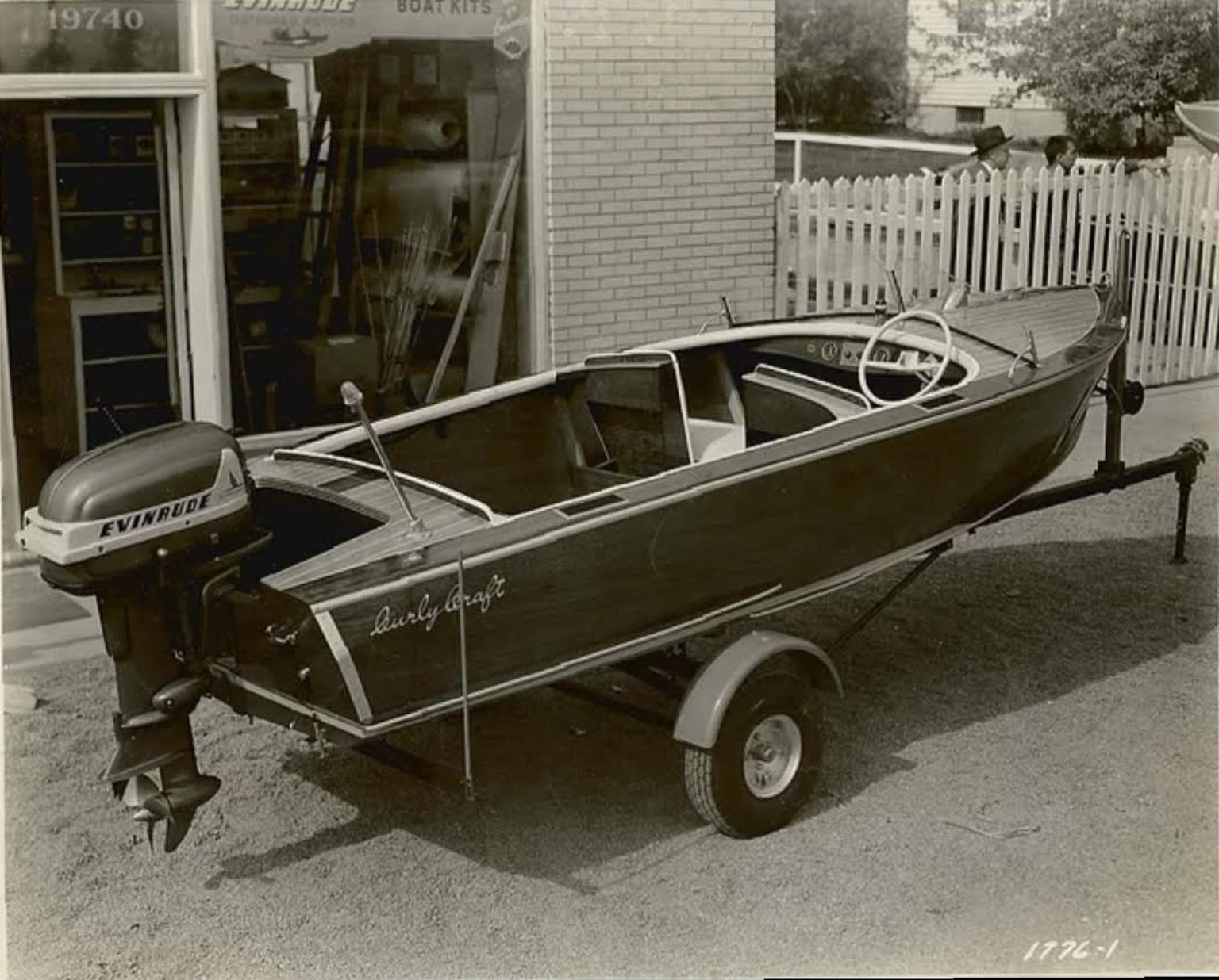 Curly Craft boat rigged with a vintage Evinrude outboard